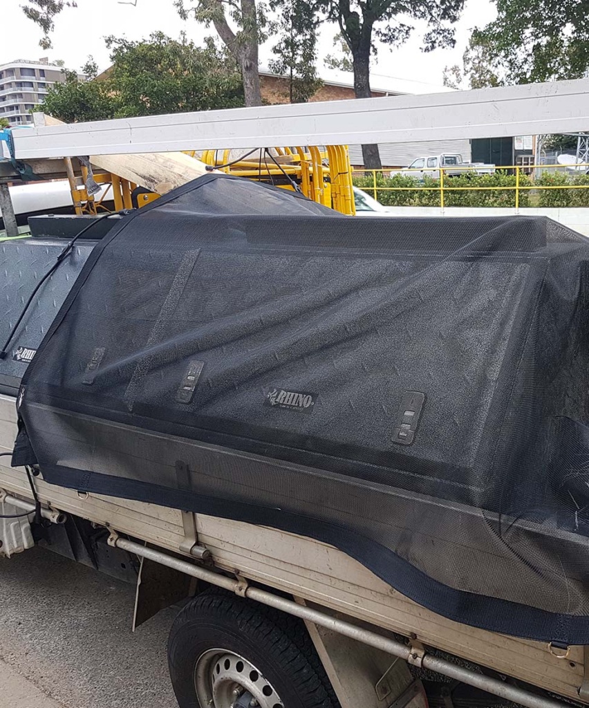 Trailer cover with mesh material tarp