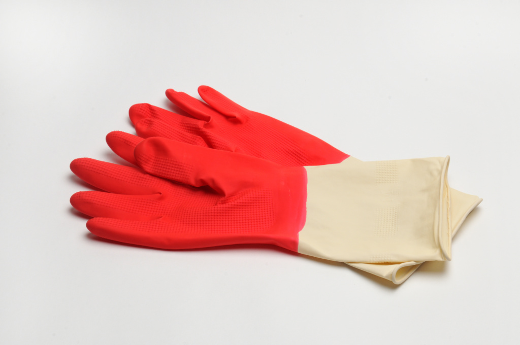 Rubber Gloves For Protecting Hands while cleaning a tarp On A White Background